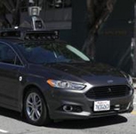 Uber halts self-driving car tests after death