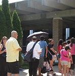 Families line up for backpacks filled with school supplies at Triton College