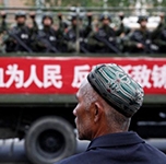 China Uighurs: Xinjiang legalises 'reeducation' camps