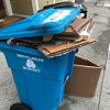 Blue bins overflow with Amazon and Walmart boxes. But we're actually recycling less