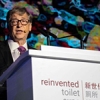 Bill Gates brandishes poo to showcase reinvented toilet tech
